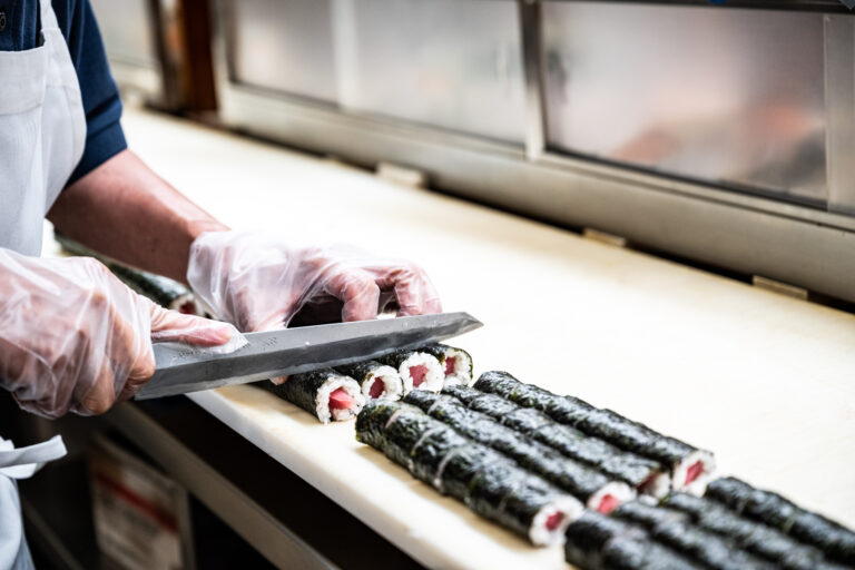 Sushi preparation at One World Market in Novi