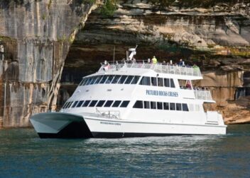 Pictured Rocks Cruises boat near Pictured Rocks cliffs